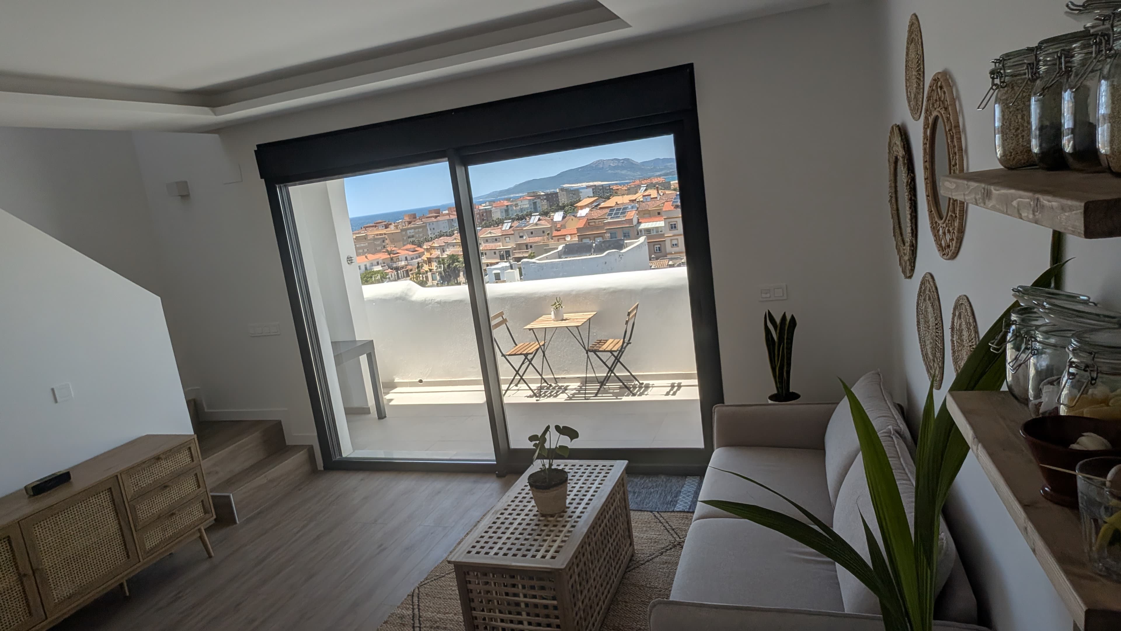 Living room looking out to the terrace and Tarifa beyond