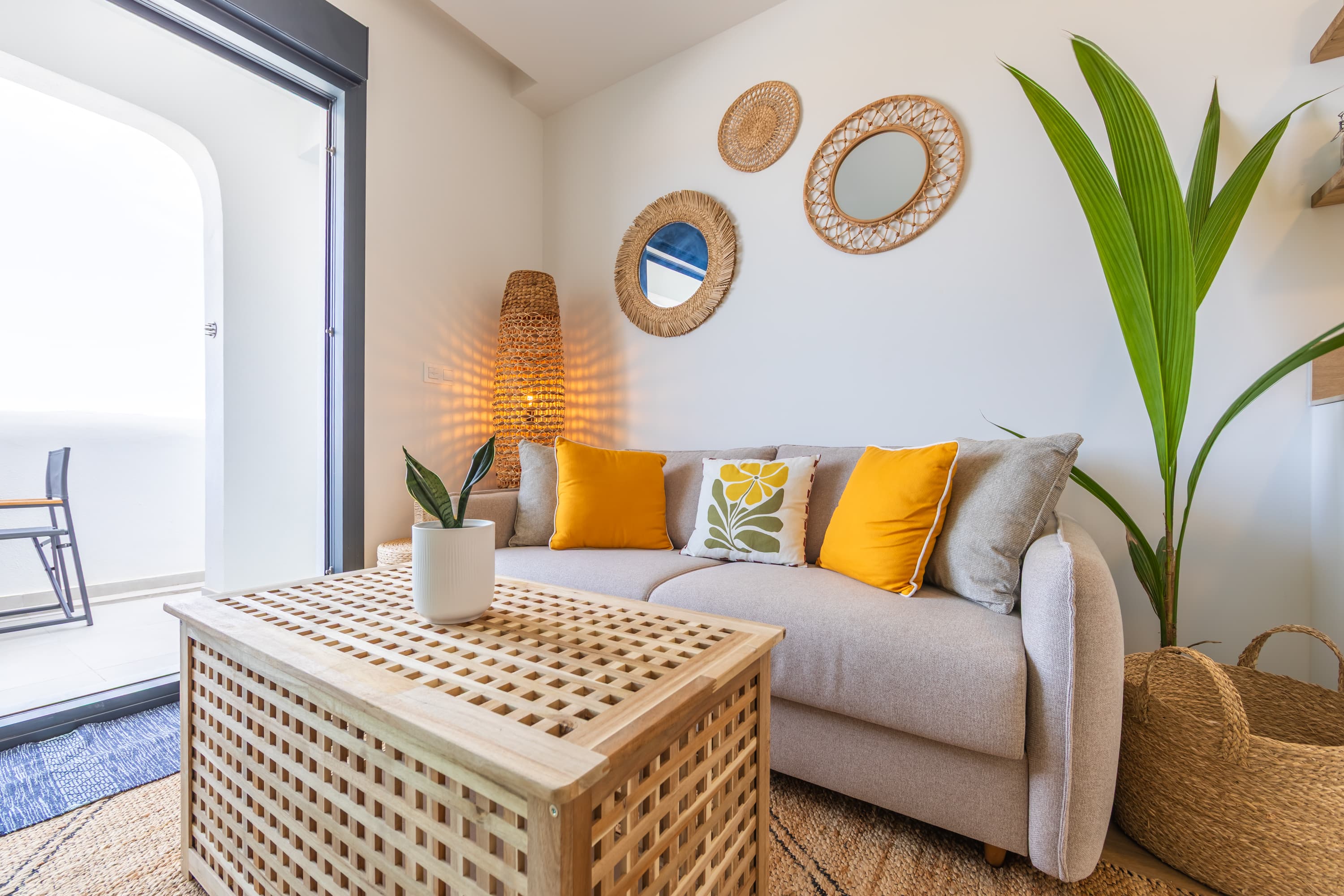 Open-plan living area with natural light and views to the terrace