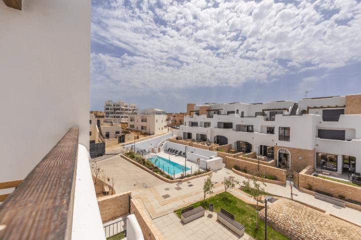 View from the Mediterranean Terrace across the communal gardens and Tarifa rooftops to the sea